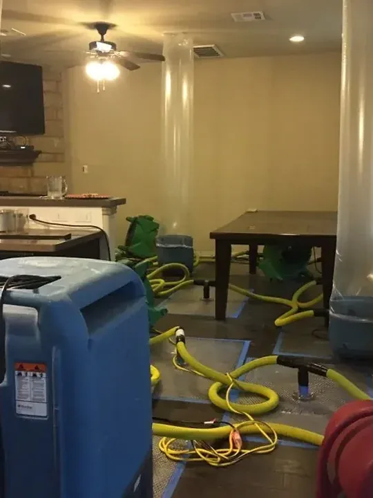 Truck-mounted extraction equipment set up on a job site